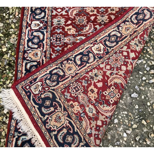 514 - Red ground wool floral pattern runner rug 270cm l x 81cm w.