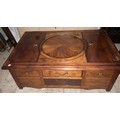 A Delacroix mahogany coffee table with drawer with lift up compartment and circular turntable to top... 