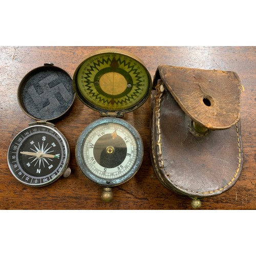 702a - Two vintage compasses, one brass cased, The Megnapole Aichison, London in leather case and a copper ... 