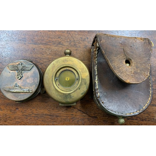 702a - Two vintage compasses, one brass cased, The Megnapole Aichison, London in leather case and a copper ... 