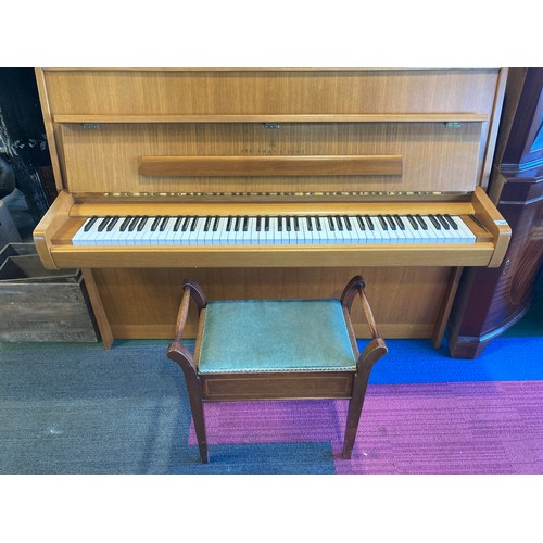 790 - A Steinway and Sons upright piano 146 w x 59 d x 114cm h and a piano stool and contents.