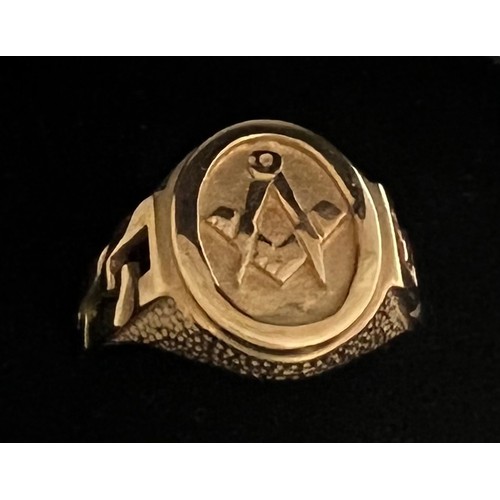 332 - A 9ct gold ring with masonic symbol to front. 5.3gm. Size P.