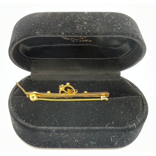 333 - A 9ct gold Edwardian bar brooch with clear stone. 1.3gm.