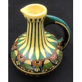 Decorative pottery jug Faience de Purmerende Hollande, numbered 1023 to the base. 18cm h.
