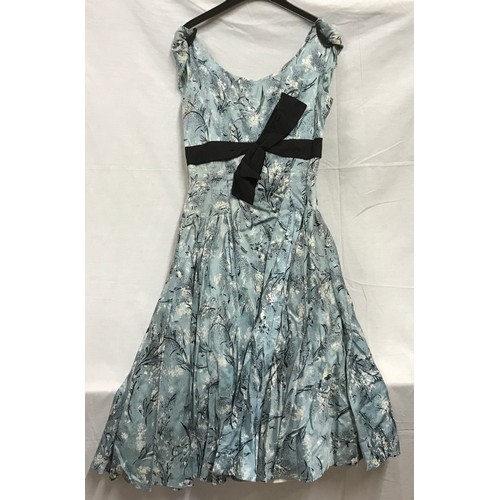 465 - A 1950's ladies dress, handmade, light blue with black bow and fitted underskirt approx. size 26 inc... 