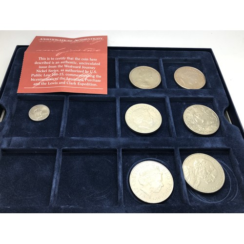 420 - A collection of coins to include 5 x £5 coins, another and a five cents coin uncirculated issue from... 