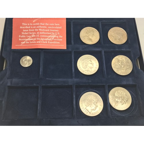 420 - A collection of coins to include 5 x £5 coins, another and a five cents coin uncirculated issue from... 