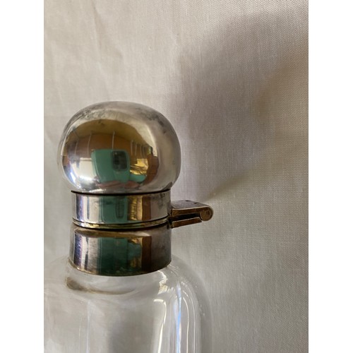 286 - Glass tier drop flask with metal stopper in a leather case. Bottle height 25cms, max width 5.5cms.