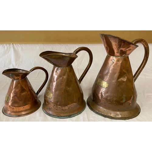 625 - Three copper jugs with brass plates denoting size i.e. Quart, Half Gallon and One Gallon. Tallest 29... 