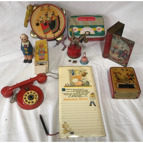 665 - A tinplate toys collection to include: German U.S. Zone Happy clown, Chad Valley Treasure Island boo... 