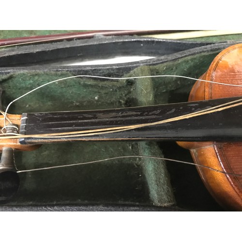 765 - A Stradivarius copy violin with bow and case, label to interior, 56 cm l.