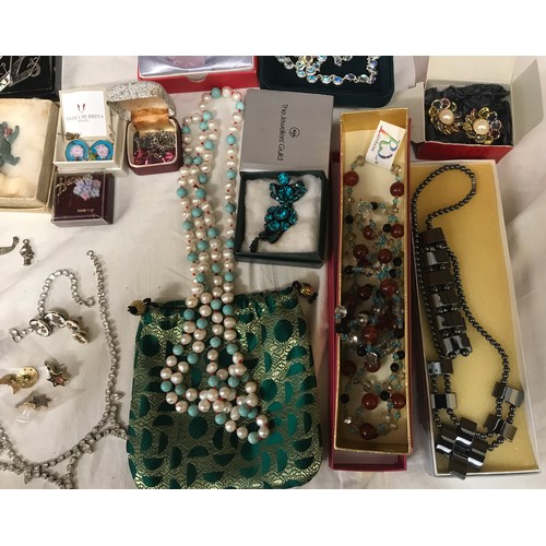 329 - A selection of costume jewellery to include necklaces, bangles, gold plate and silver plate, earring... 