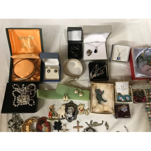 329 - A selection of costume jewellery to include necklaces, bangles, gold plate and silver plate, earring... 