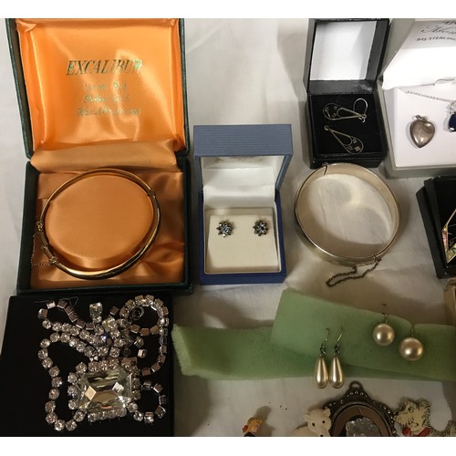 329 - A selection of costume jewellery to include necklaces, bangles, gold plate and silver plate, earring... 