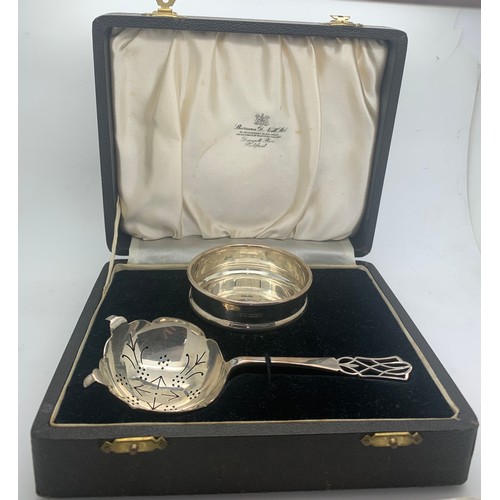 532 - A boxed silver tea strainer and bowl, Sheffield 1938 maker Viners.