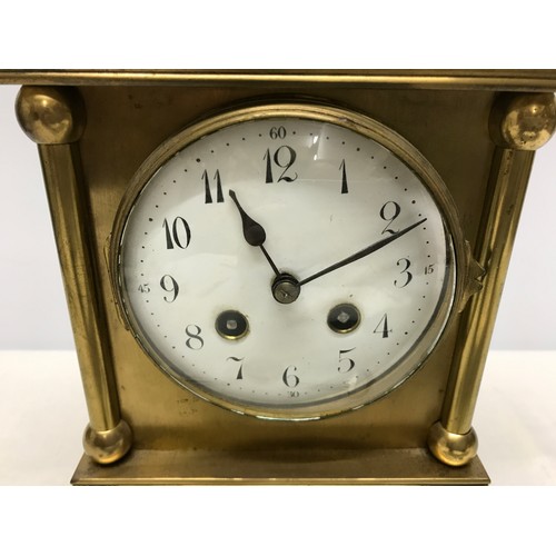 805 - A French brass mantle clock, enamel face, movement marked Japy Freres GDE.MED.D. HONNEUR, has pendul... 