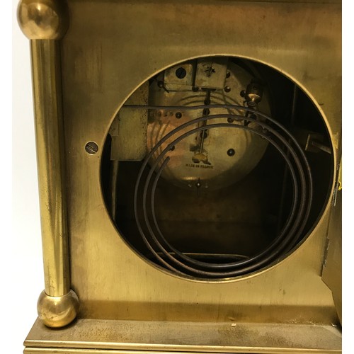 805 - A French brass mantle clock, enamel face, movement marked Japy Freres GDE.MED.D. HONNEUR, has pendul... 