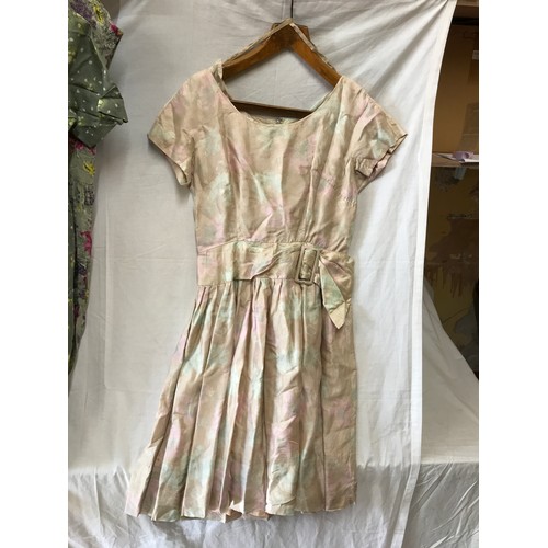 475 - A selection of vintage dresses to include a green button front dress size 40, grey and multi coloure... 