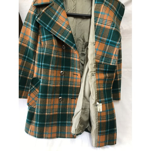 477 - A short brown suede jacket together with a green and orange checked wool mixed coat.