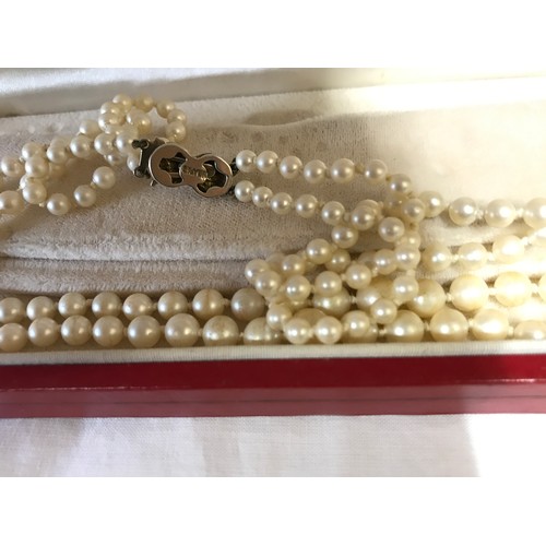 346 - A boxed pearl necklace with silver clasp together with another pearl necklace with silver clasp, a n... 