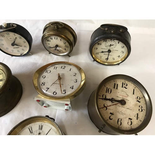 806 - Selection of 7 alarm clocks, not tested, some need obvious restoration. Tallest 12.5cms.