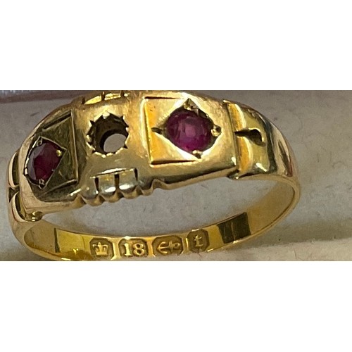 348 - Eighteen carat gold ring set with 2 rubies. Weight 2.8gm.