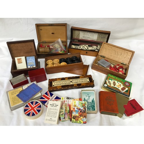 670 - A collection of 19thC and vintage games to include a burr wood box of bone dominoes, a bone cribbage... 