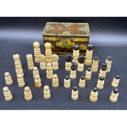 671 - A complete 19thC bone chess set in a metal box.