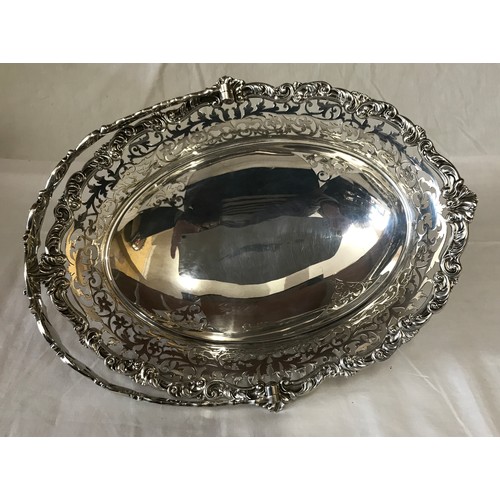 539 - Silver bowl with handle by William Hutton & Sons, London 1907. 31cm l x 25cm h to top handle x 25cm ... 