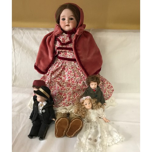 672 - An Armaud Marseille doll approx. 47cm h together with four smaller dolls, 17cm h.