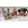 Five character figurines: Toby jug of a cavalier, Royal Doulton 'Spring Morning' and 'Autumn Breezes... 