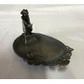 A WMF dish depicting a lady releasing a duck into a pond. 15 l x 9.5cm w.