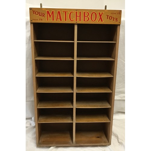 678 - Matchbox Toys wall mounted display shelf, pine cased, 6 height with Matchbox advertising panel. 12 s... 