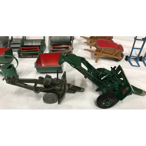 689 - Dinky diecast garden equipment, grass cutters, rollers, wheelbarrows, sack barrows, Dinky Johnston r... 