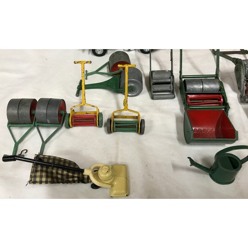 689 - Dinky diecast garden equipment, grass cutters, rollers, wheelbarrows, sack barrows, Dinky Johnston r... 