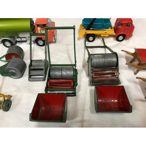 689 - Dinky diecast garden equipment, grass cutters, rollers, wheelbarrows, sack barrows, Dinky Johnston r... 