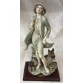 A Florence figurine of a lady and a dog 36cms h by Giuseppe Armani.