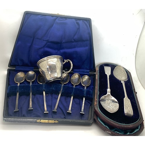 541 - Hallmarked silver spoons and a cup marked 800. Total weight 140.4gms.