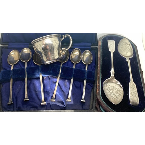 541 - Hallmarked silver spoons and a cup marked 800. Total weight 140.4gms.