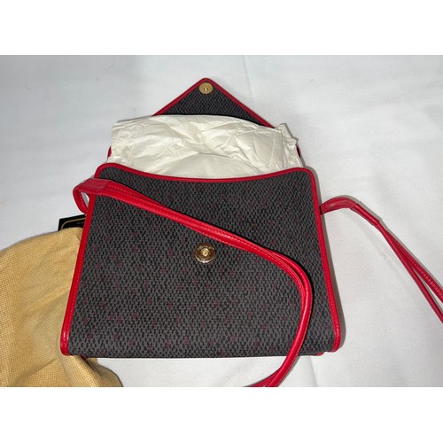 493 - A 1980's Yves Saint Laurent red part leather two section handbag.  23 w x 20cm h.