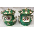 A pair of large 19thC continental ice pails with floral panels on a emerald green and gold backgroun... 