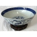 Chinese Blue and White Bowl on Wooden Stand. Bowl measures 26cms diameter, 9cms in height.