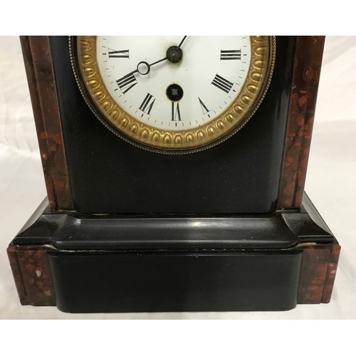 818 - Stone mantel clock with roman numerals 24.5cms h, 23cms w, max depth 13cms.