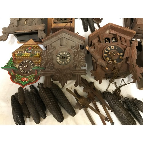 827 - Box of 12 Cuckoo Clock Frames incl weights, pendulums etc for spares and repairs.