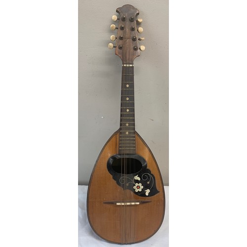 772 - A vintage mandolin. 62cm l.