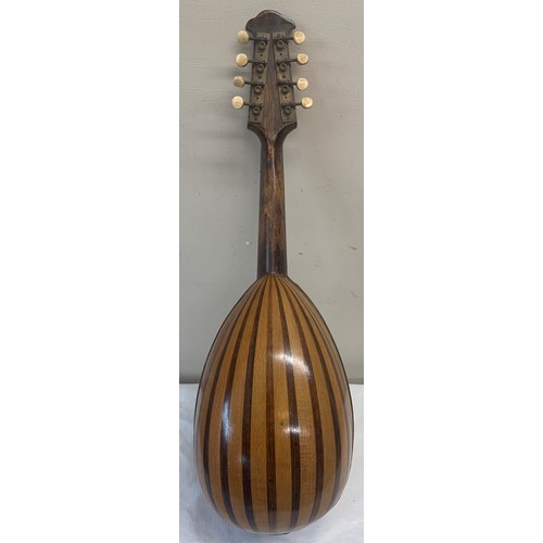 772 - A vintage mandolin. 62cm l.