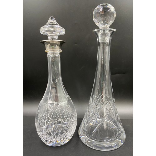 305 - Five cut glass decanters. Tallest 37cm. One with etched lion to base.