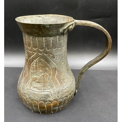 796 - Middle Eastern hand beaten silvered copper drinking vessel of crude design.