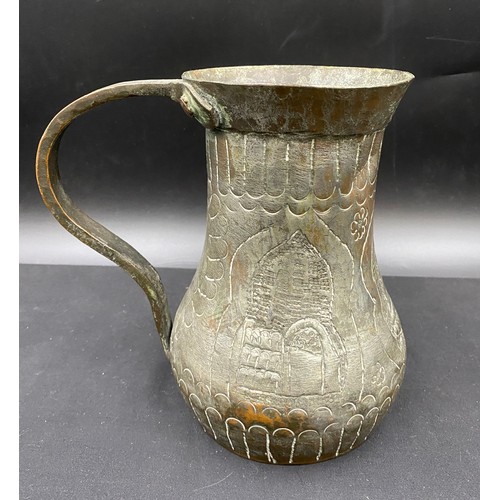 796 - Middle Eastern hand beaten silvered copper drinking vessel of crude design.