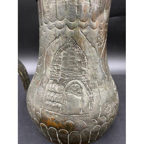 796 - Middle Eastern hand beaten silvered copper drinking vessel of crude design.